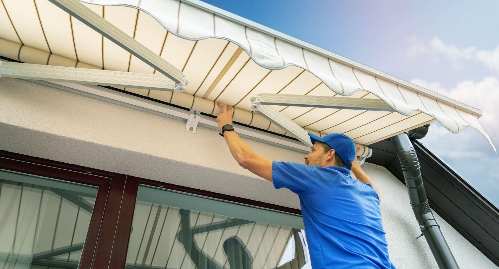 man installing awnings
